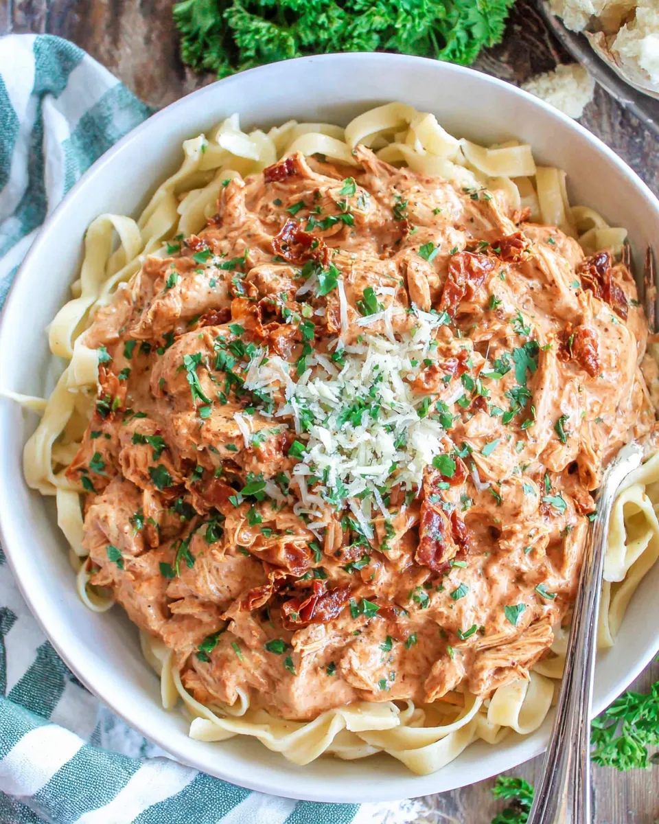 Delicious Crockpot Sun-Dried Tomato Chicken Alfredo recipe image