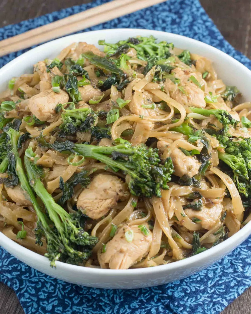 Delicious Thai-Style Stir-Fried Noodles with Chicken and Broccolini dish photo